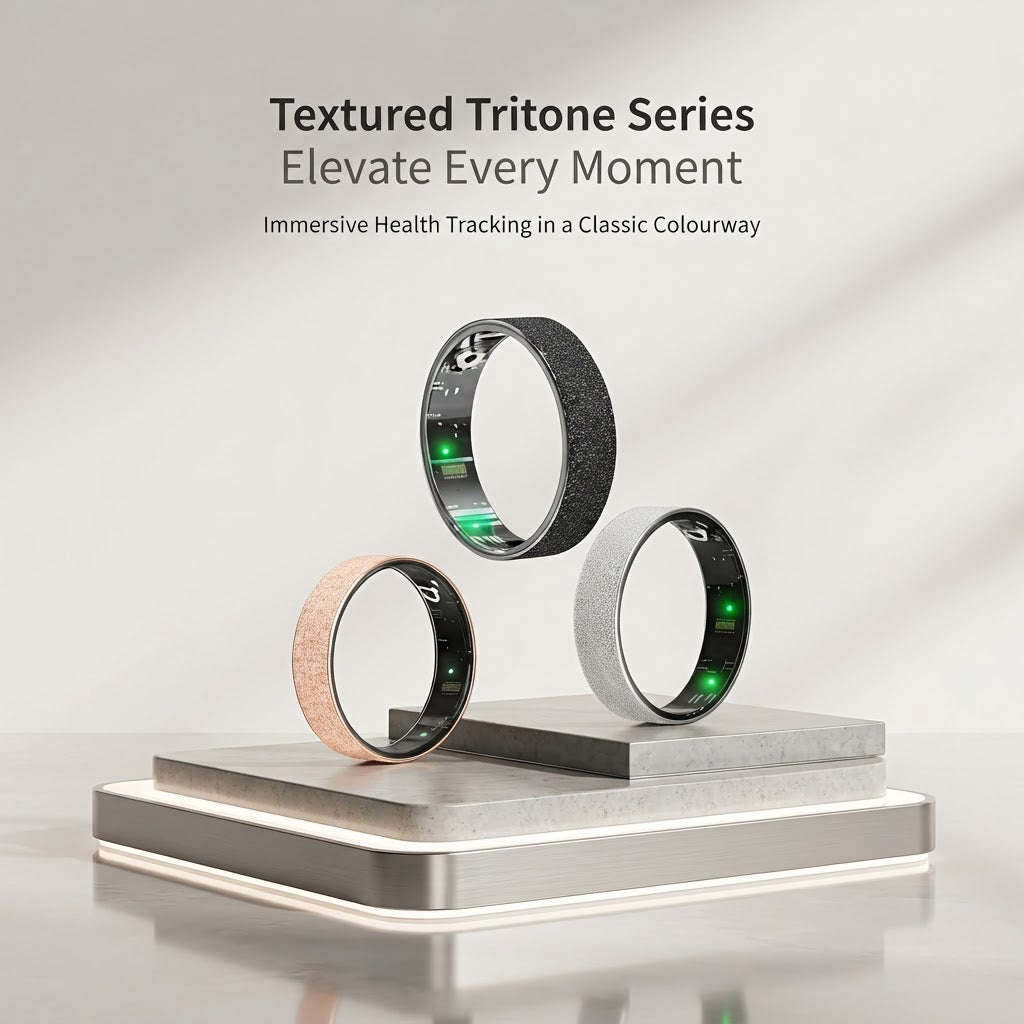 Textured tri-tone smart health tracker rings in silver, rose gold, and dark tones on a stand.