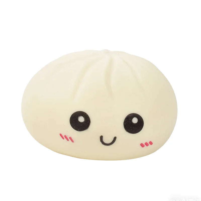 Cream dumpling squishy stress ball with smiling face and round eyes