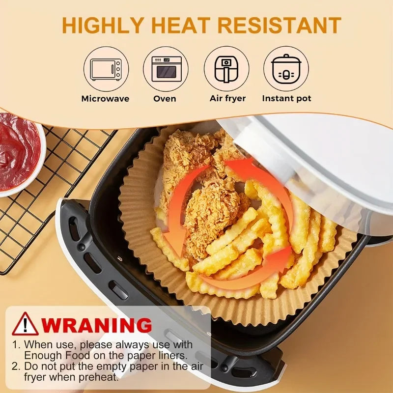 Air fryer paper liner in the air fryer basket holding fries and coated food