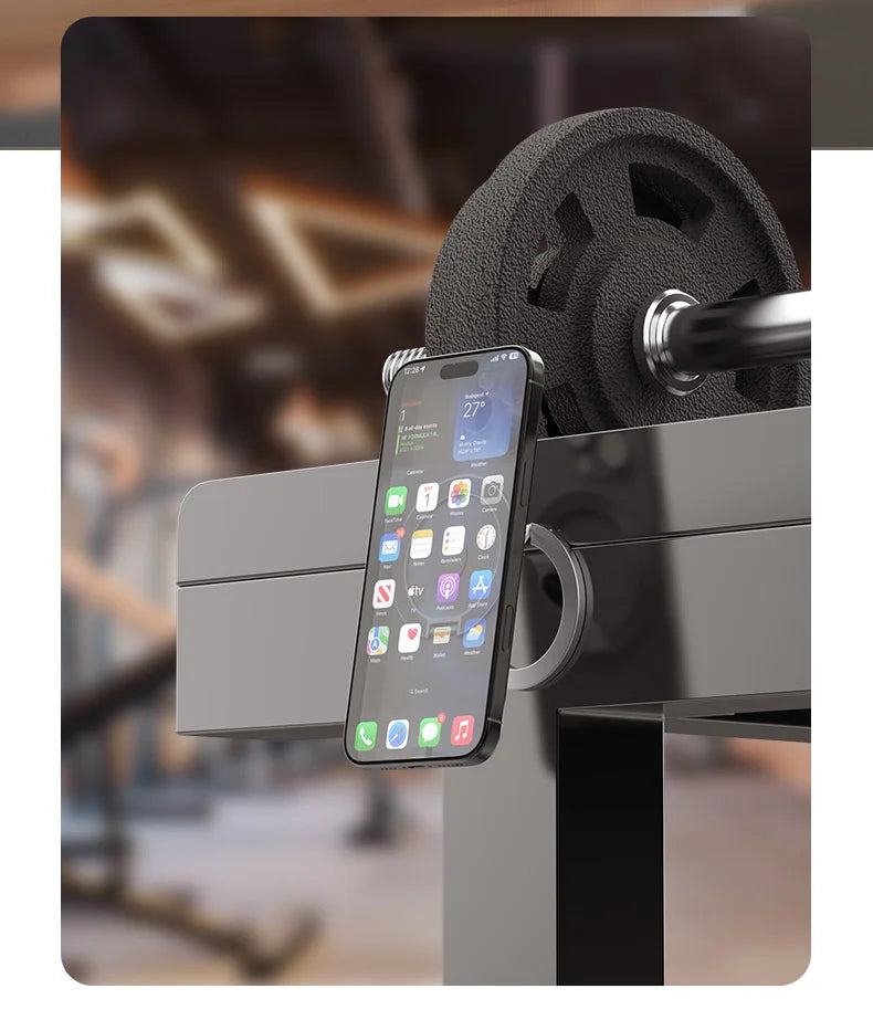 Magnetic phone stand with gyroscope base attached to gym equipment