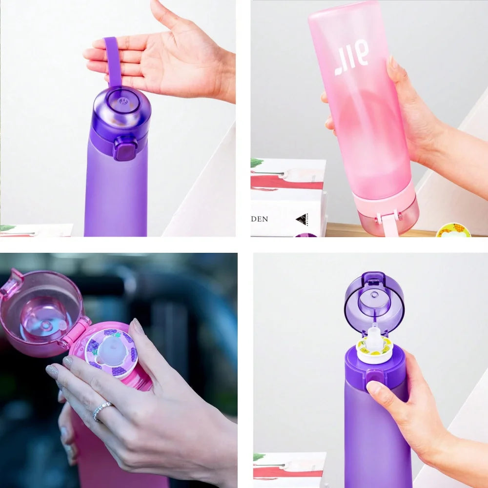 Purple and pink air water bottles with open lids and removable flavor pod inserts