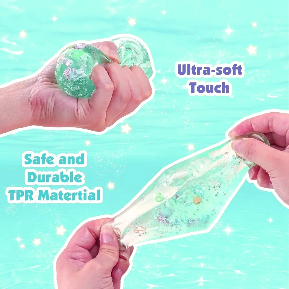 Turquoise squishy stress ball cube stretched and pinched in hands, sea-themed contents inside