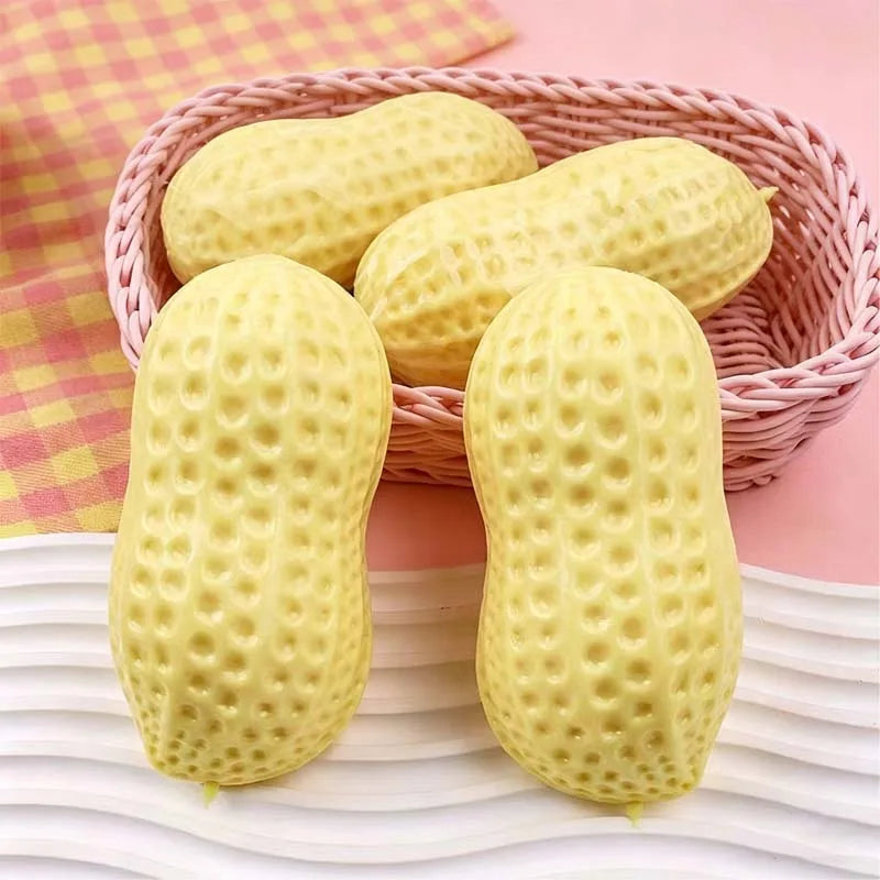 Yellow peanut-shaped squishy stress toys with textured surface in a pink basket