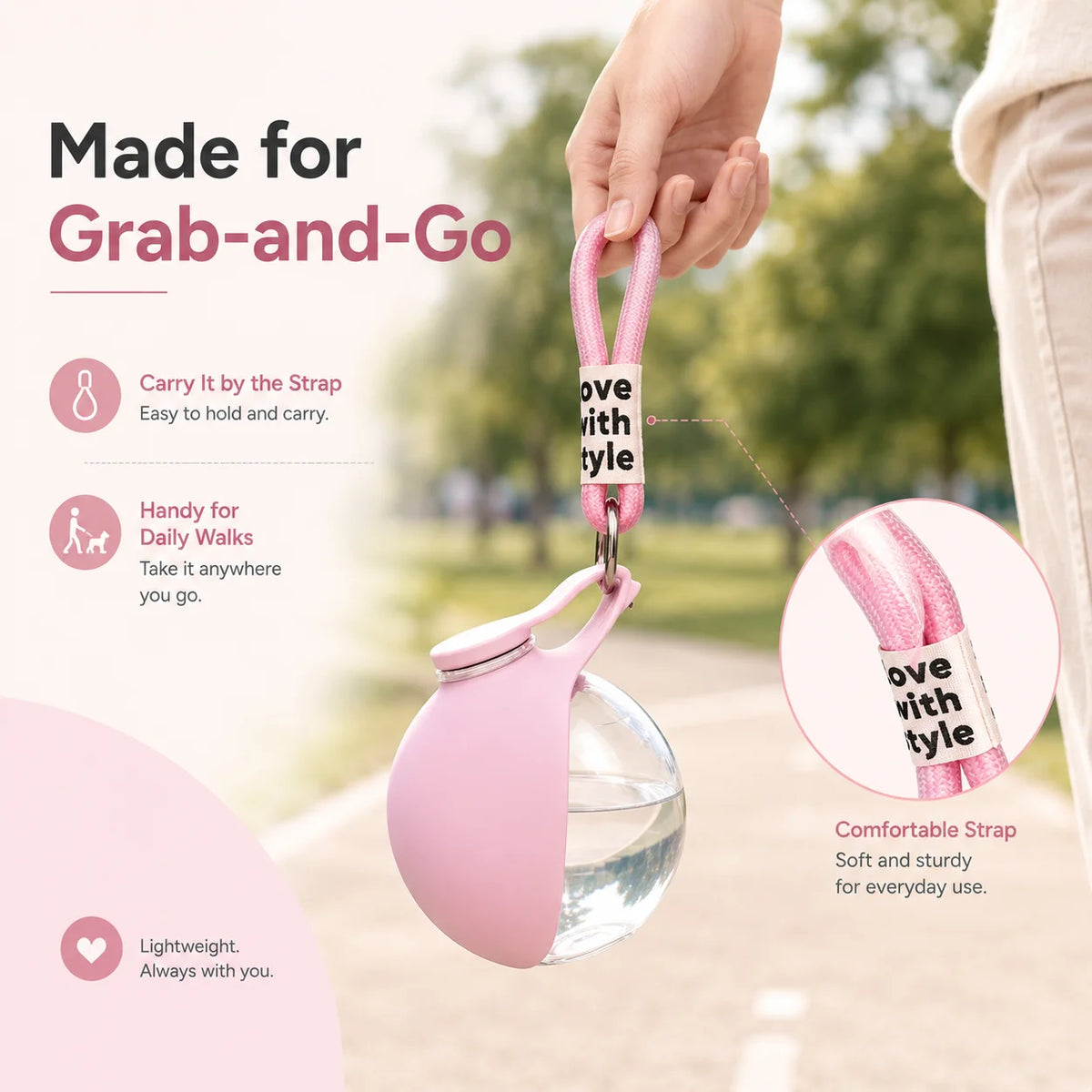 Pink grab-and-go pet water bottle with clear container and comfortable strap