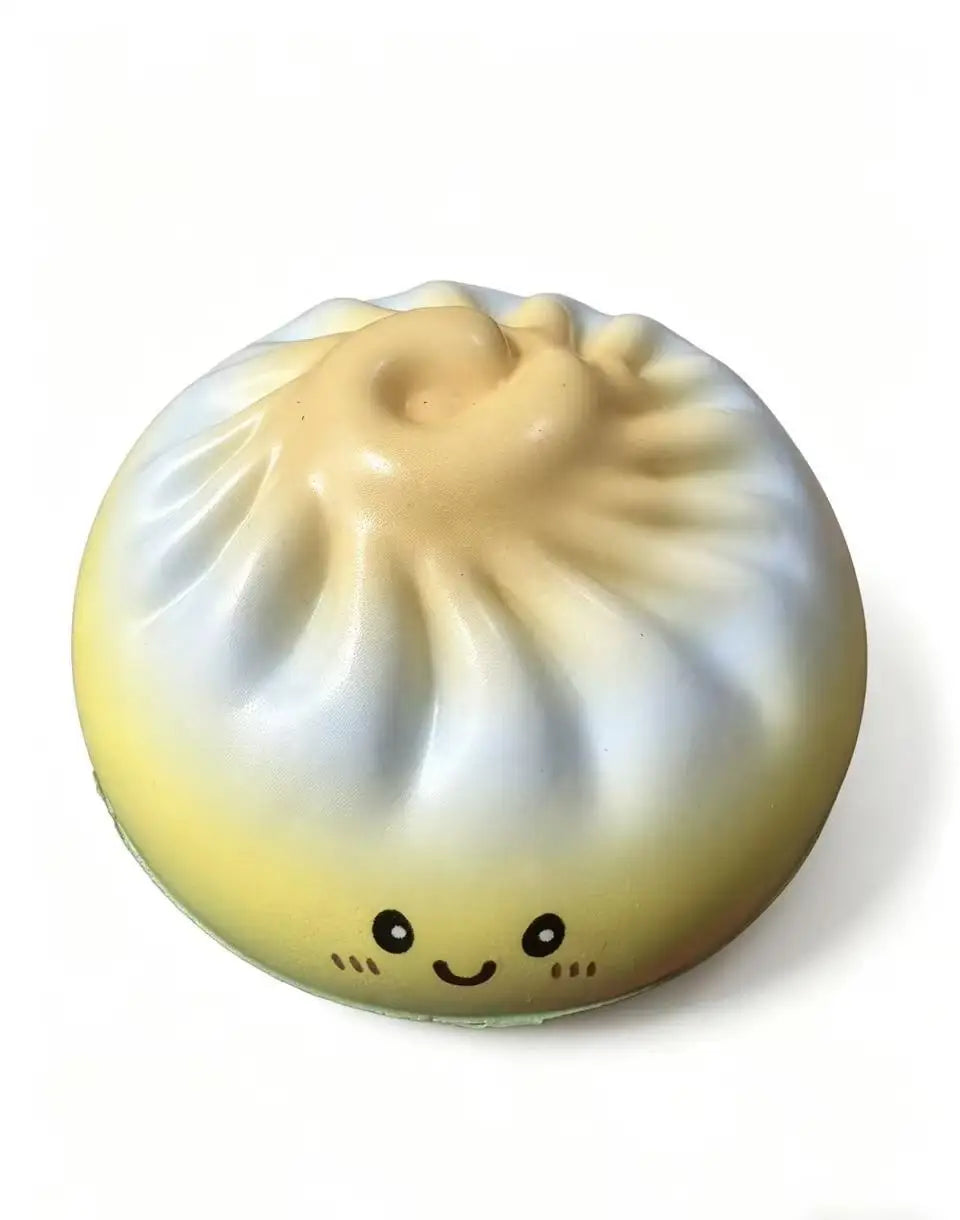 Pastel dumpling squishy toy with cute face and ribbed top, smiling expression.
