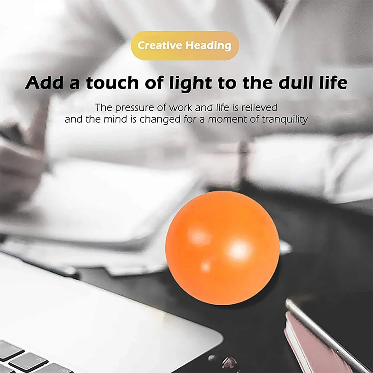 Orange glow sticky squishy ball on a surface