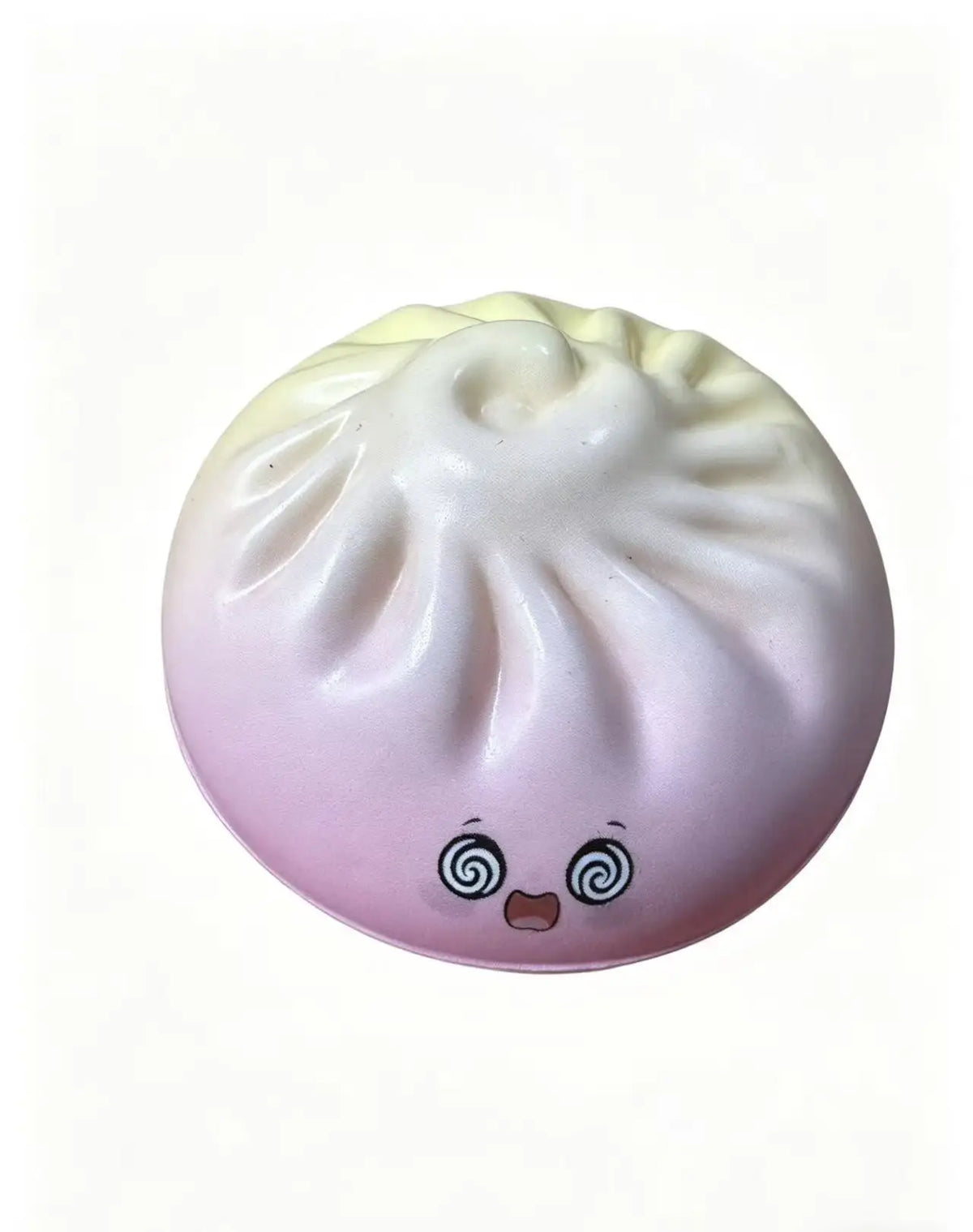 Pale lavender dumpling squishy toy with smiling face and swirl eye details