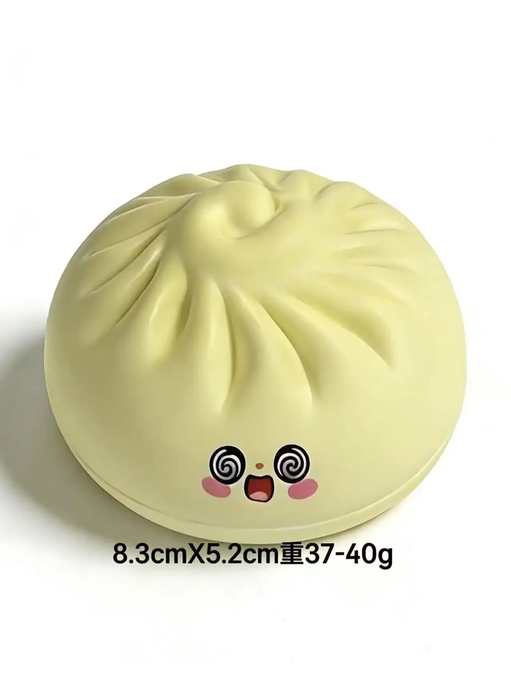 Light yellow dumpling-style squishy toy with cute face and spiral-eyed details