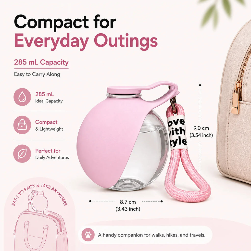 Pink portable pet water bottle with clear round container and carrying strap