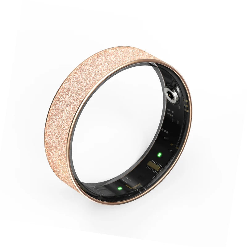 Rose gold textured health tracker ring close-up with black sensor window and green LEDs