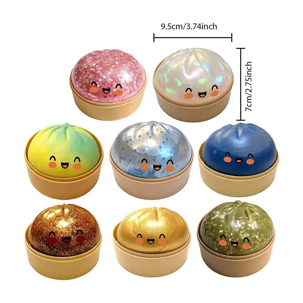 Nine glitter squishy dumpling stress balls with cute faces in round gold bases
