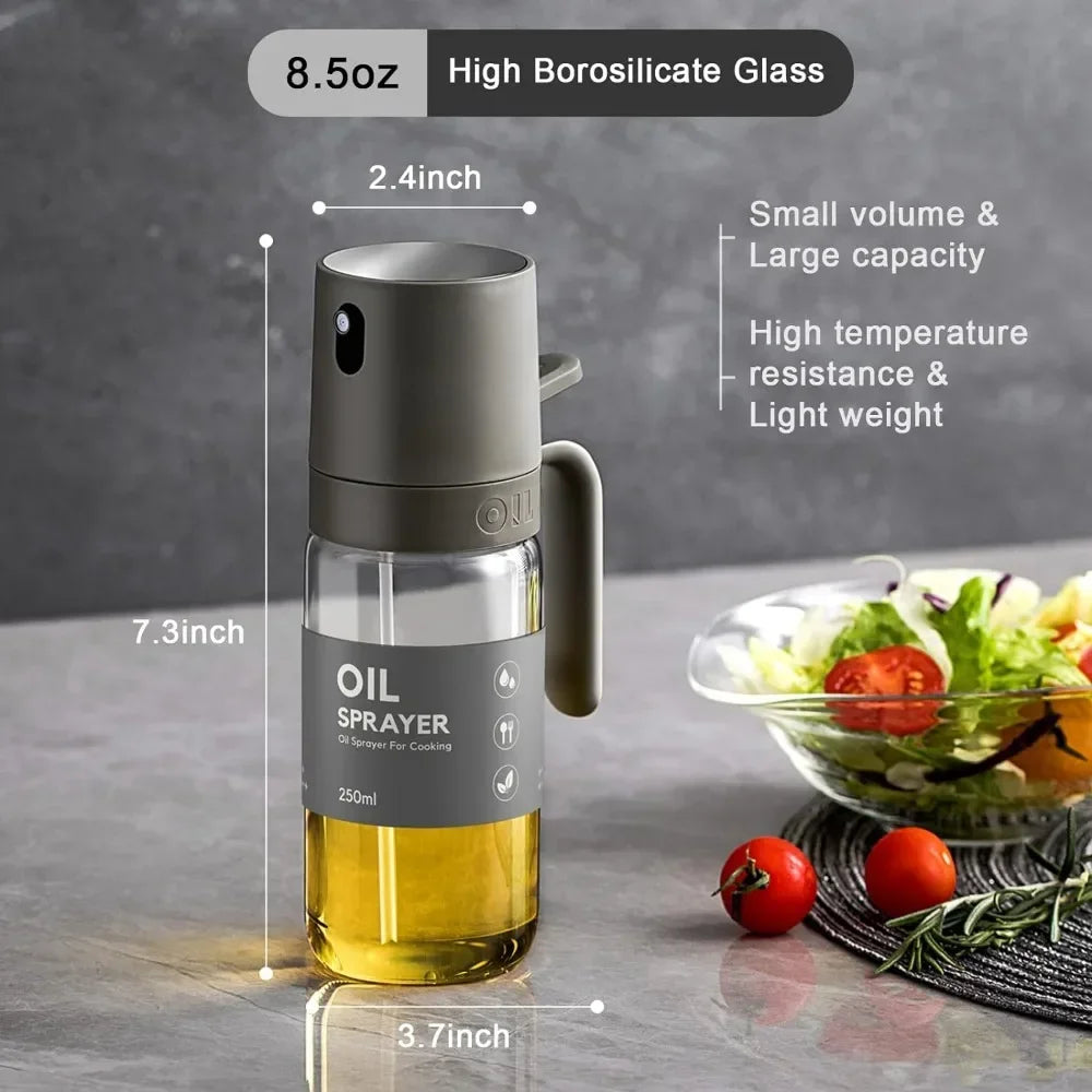 8.5 oz borosilicate glass oil sprayer bottle with gray handle and clear yellow reservoir