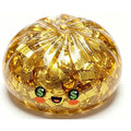 Gold glitter steamed-bun stress ball with smiling face and dollar-sign eyes, round squishy