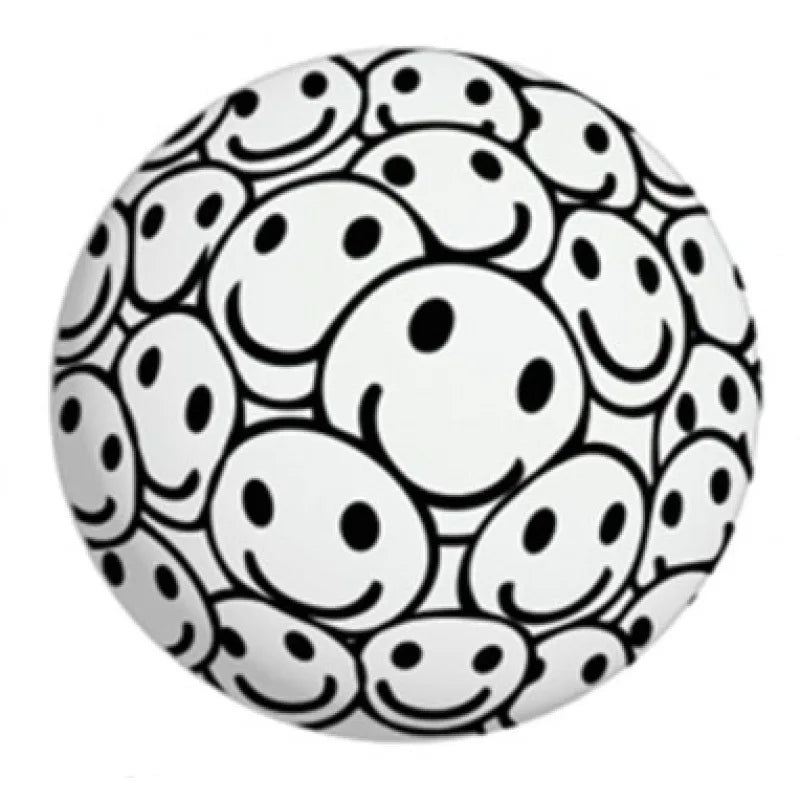Black-and-white dog-face patterned press-and-squeeze stress ball with oval spots