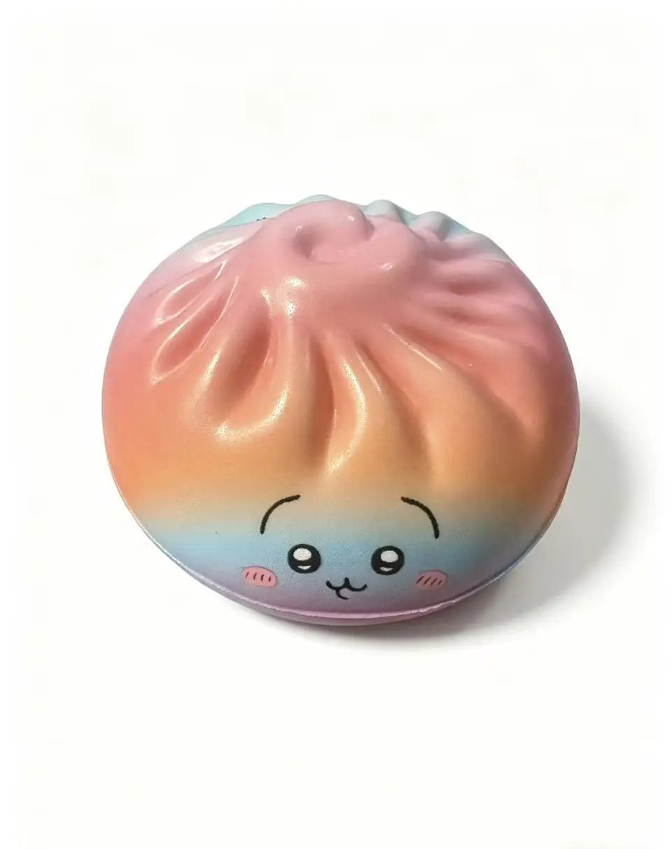 Pastel orange pink dumpling squishy toy with closed-mouth smile and shiny top