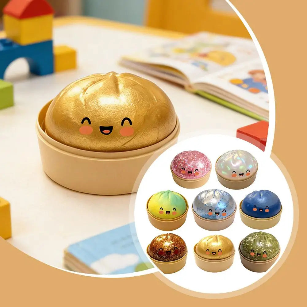 Gold glitter squishy dumpling stress ball with cute face, with multicolor assortment inset