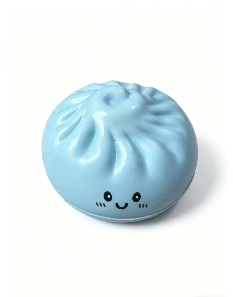 Light blue dumpling squishy toy with smiling face and steamed bun ridges