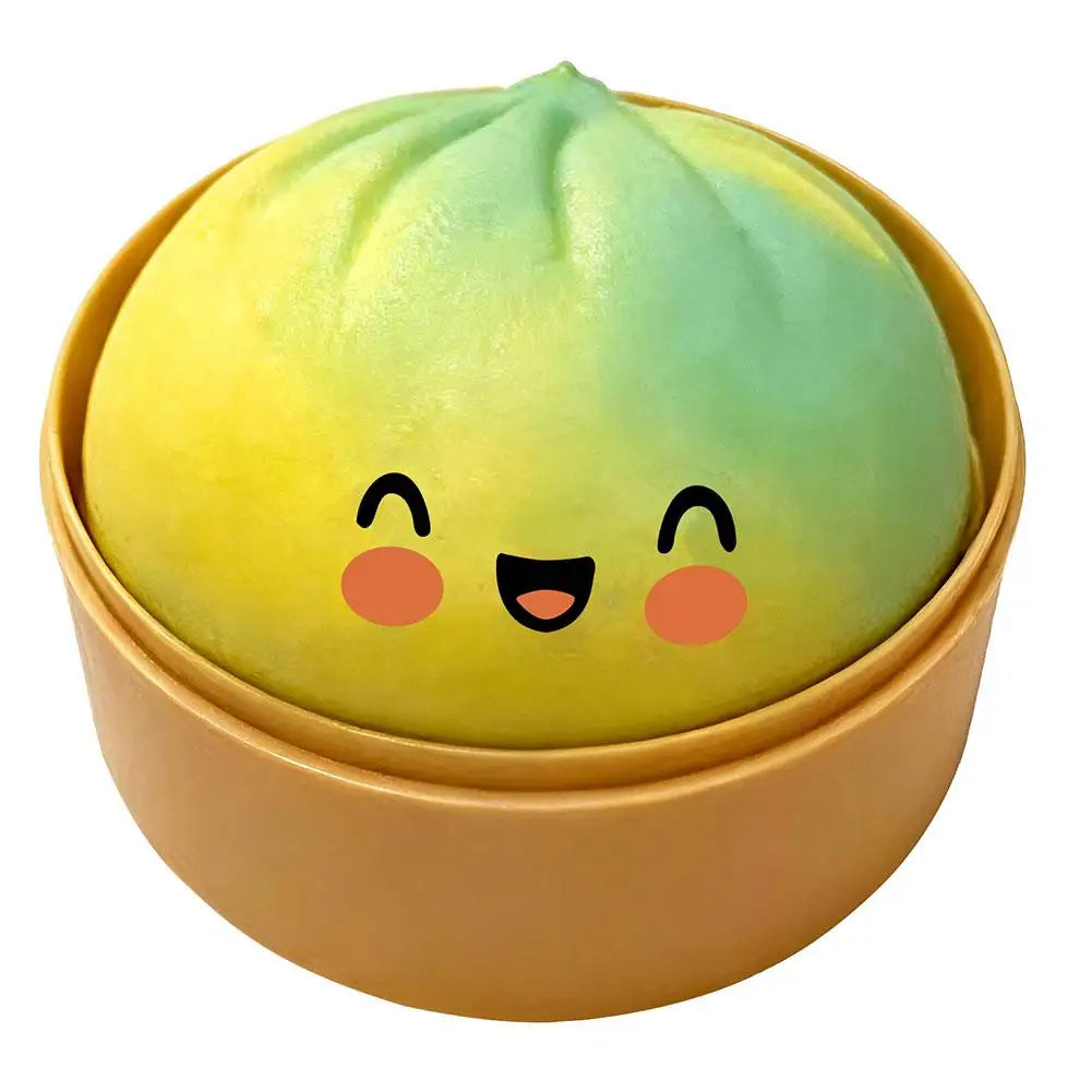 Green-to-yellow squishy bun stress ball in beige round case, smiling face with blush
