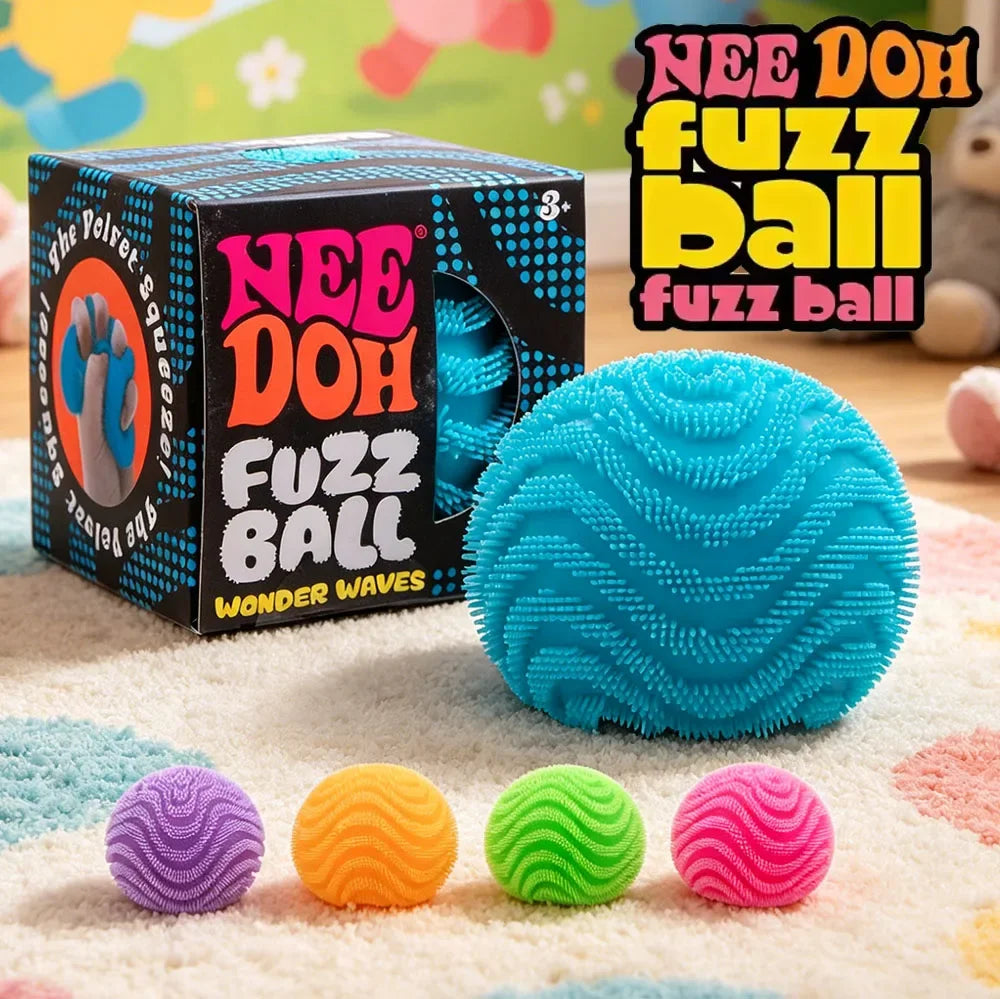 Blue fuzz ball stress toy with wave texture beside purple, orange, green, and pink balls