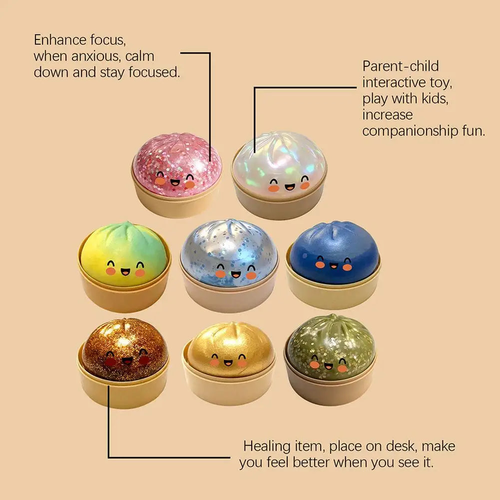 Multicolor bun squishy stress balls with smiling faces, glitter domes on gold bases