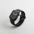Black smartwatch with square face and silicone band, glowing dot dial