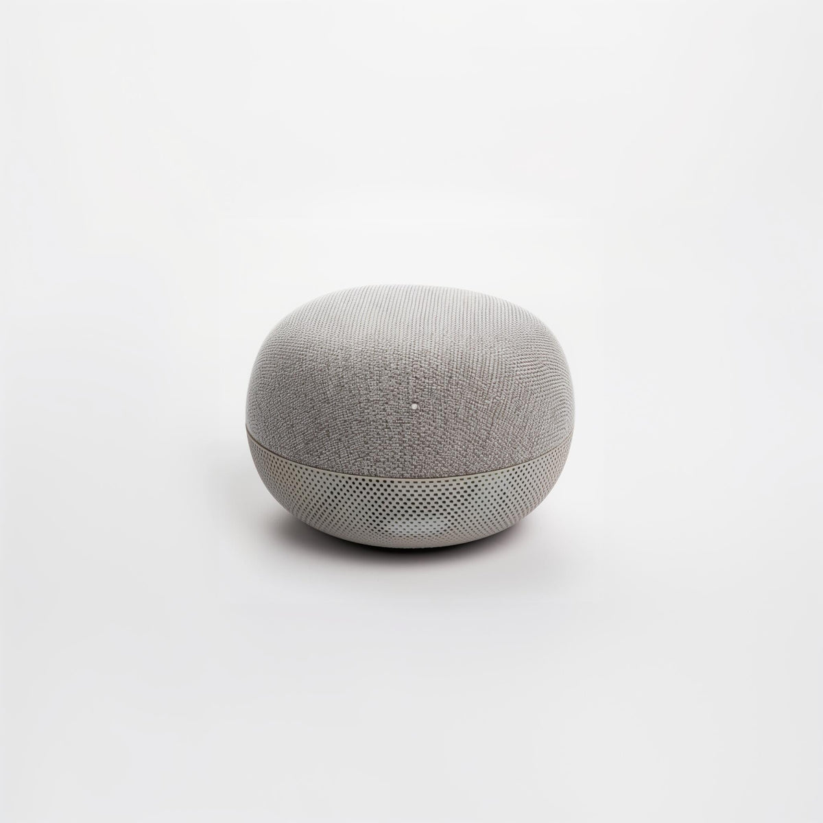 Light gray spherical fabric speaker with perforated bottom grille