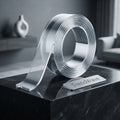 Double-sided reusable tape roll on metal tray dispenser with clear tape strip